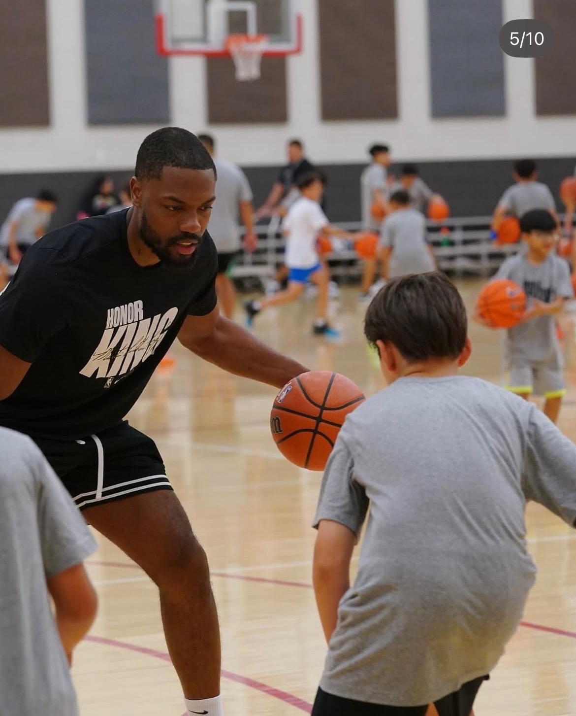 Shawn coaching ball-handling drills at camp