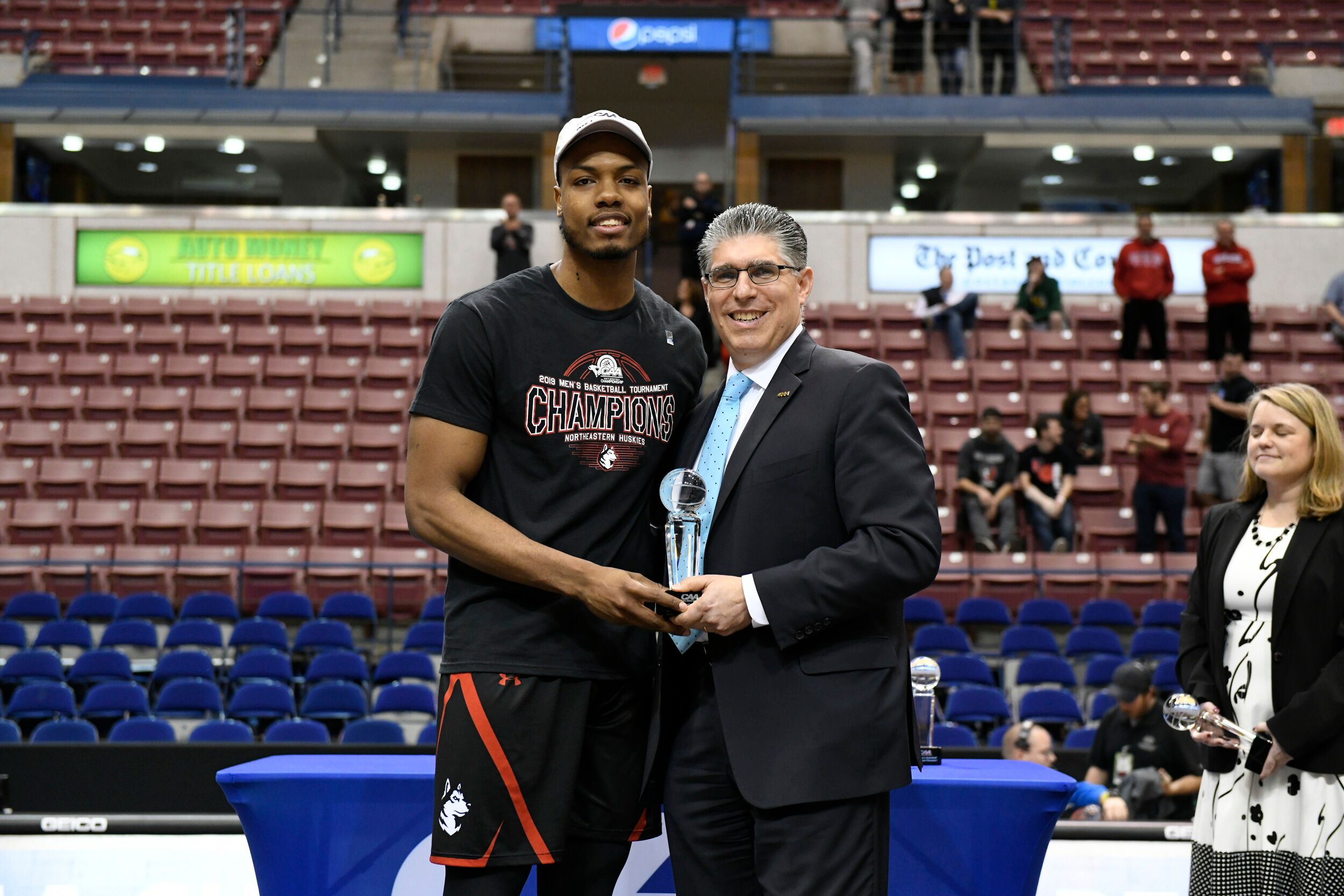 Shawn Occeus receiving championship award at Northeastern University